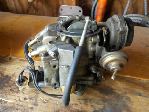 1986 Ford Bronco - A carburetor, a critical engine component, is shown in detail.