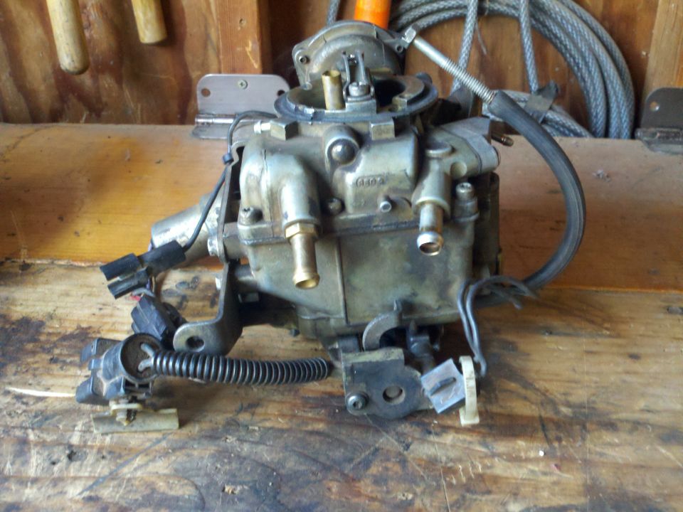 Carburetor with visible text and electrical connectors
