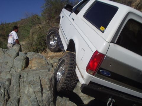 1993 Ford Bronco - This 1993 Ford Bronco navigates a challenging rocky terrain, its off-road capabilities.