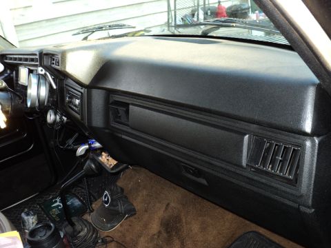 1986 Ford Bronco - Interior view of a 1986 Ford Bronco dashboard, showing gauges, radio, and shifter.