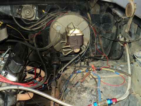 1986 Ford Bronco - Close-up view of the engine bay, focusing on the brake system components and associated wiring.