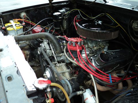 1986 Ford Bronco - Close-up view of a V8 engine bay, showing various components and wiring.