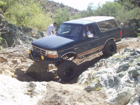 1993 Ford Bronco - This 1993 Ford Bronco tackles a challenging rocky path, its off-road capabilities.