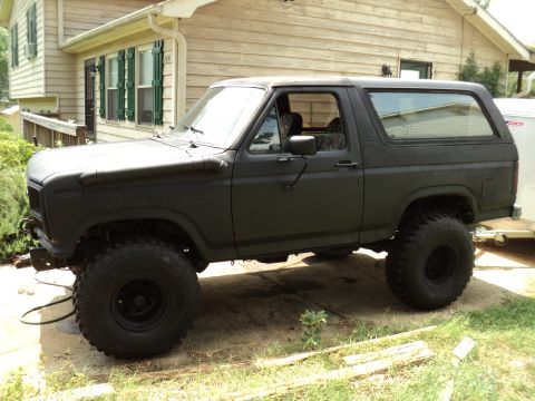 1986 Ford Bronco - This matte black Ford Bronco appears to be from the early 1980s, not a 1986 model.