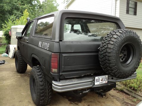 1986 Ford Bronco - This black SUV features a snorkel and a spare tire mounted on the rear, with "MR. HYDE" lettering on the side.