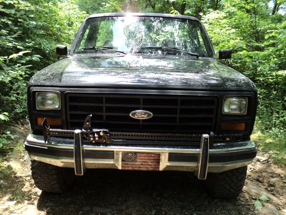 1986 Ford Bronco front view with winch and flag decal