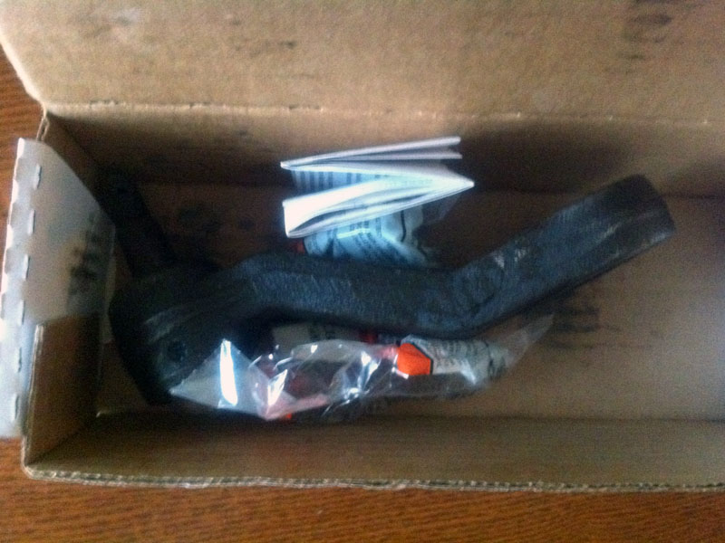 Car part in a cardboard box with instructions