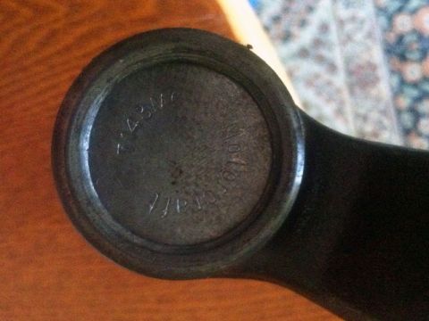 2001 Mercury Grand Marquis - A close-up view of a dark metal steering component with stamped lettering.