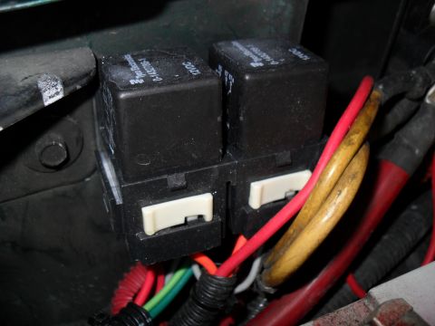 1990 Ford Bronco - Close-up of automotive relays and wiring harness components.