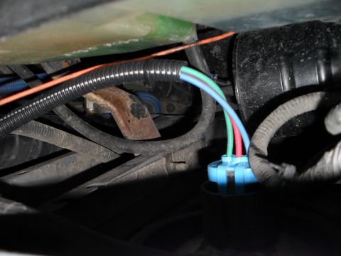 1990 Ford Bronco - Close-up of a vehicle's wiring harness connector and wires.