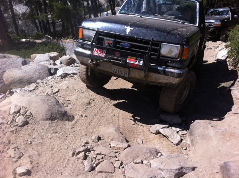 1990 Ford Bronco - This 1990 Ford Bronco navigates a challenging rocky terrain, its off-road capabilities.