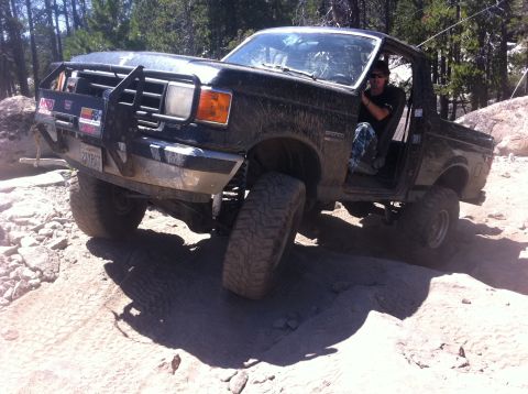 1990 Ford Bronco - This 1990 Ford Bronco navigates a challenging rocky terrain during an off-road excursion.