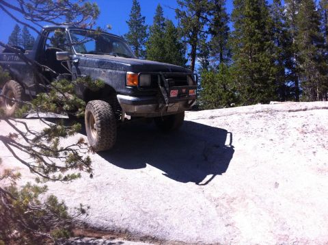 1990 Ford Bronco - This 1990 Ford Bronco is seen navigating a rocky, wooded landscape.