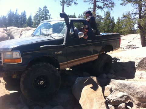 1990 Ford Bronco - This modified Ford Bronco navigates a rocky trail with a snorkel for water crossings.