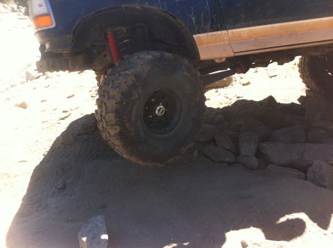 1990 Ford Bronco - This 1990 Ford Bronco navigates a challenging rocky trail, its off-road capabilities.