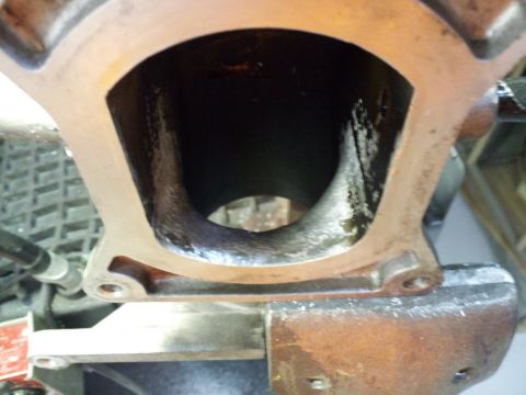 2000 Mercury Grand Marquis - This is a close-up view of an engine's intake manifold port, revealing the internal passage.