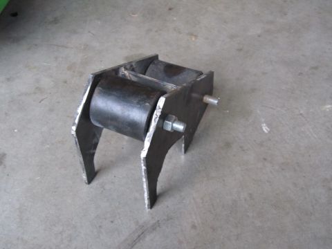 1984 Ford Bronco - A custom suspension part, likely for off-road modification, is shown on a concrete floor.