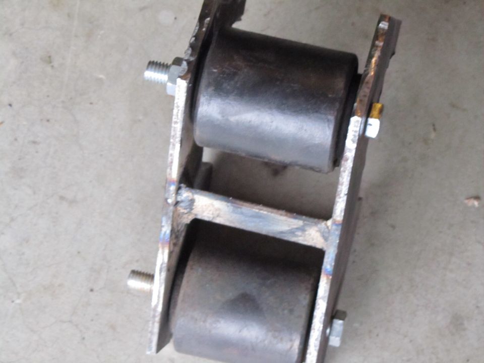 Custom roller assembly with two black rubber rollers mounted on metal brackets