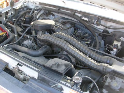 1995 Ford Bronco - He hasn't had the cruise recall done yet. Throttle linkage cover E9TA9E766AA