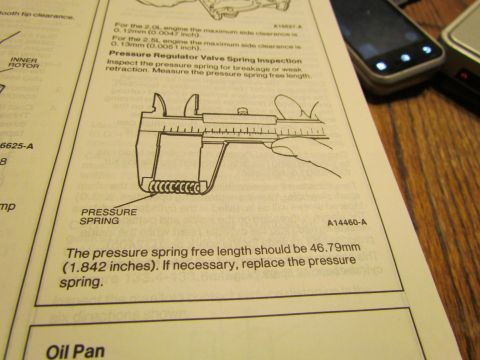 1995 Ford Probe - Manual page details pressure spring inspection, specifying free length measurement with a caliper.