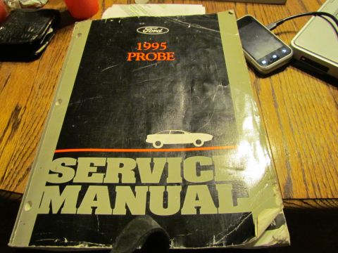 1995 Ford Probe - Service manual for a 1995 Ford Probe, showing the car's silhouette on the cover.