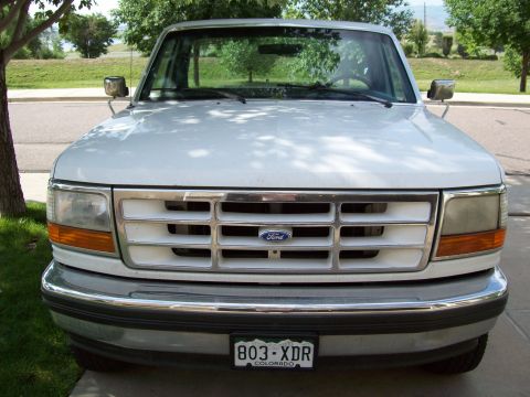 1993 Ford F-150 - The grille design and headlights suggest this Ford truck is from the early to mid-1990s, likely a 1992 model.