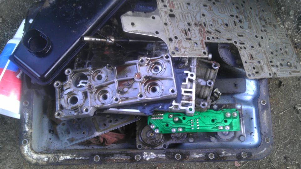 Transmission valve body and filter disassembled in a pan