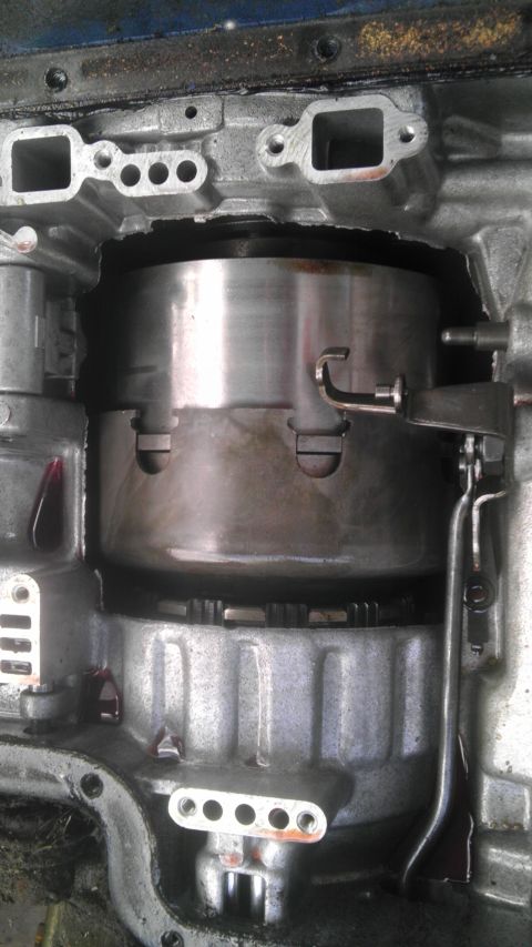 1989 Ford Bronco - Automatic transmission internals during a rebuild, focusing on the torque converter and clutch assembly.