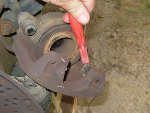 1983 Ford Bronco - Always clean the surfaces that touch the pad backing plates (& all other points of metal-to-metal contact) before applying brake grease to…