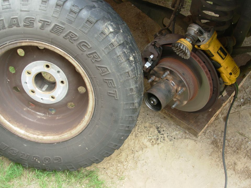 Mastercraft tire beside a front brake assembly being wire-wheeled