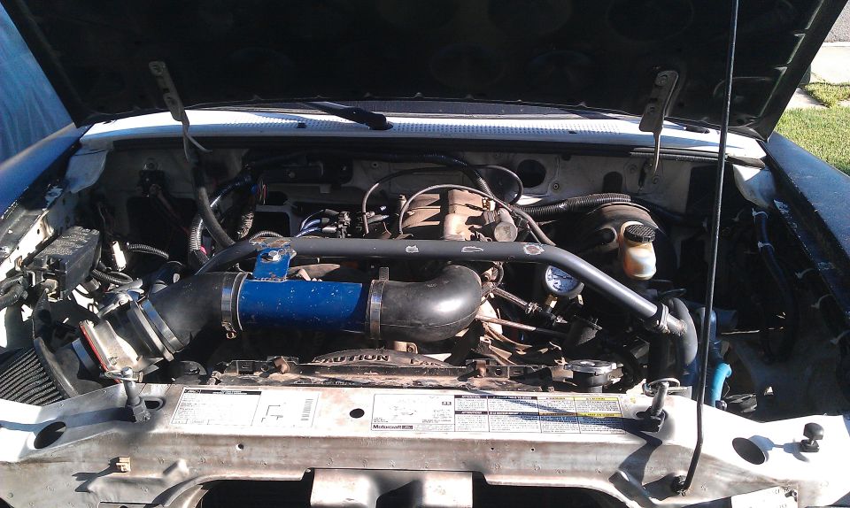 1992 Ford Ranger engine bay with aftermarket intake piping