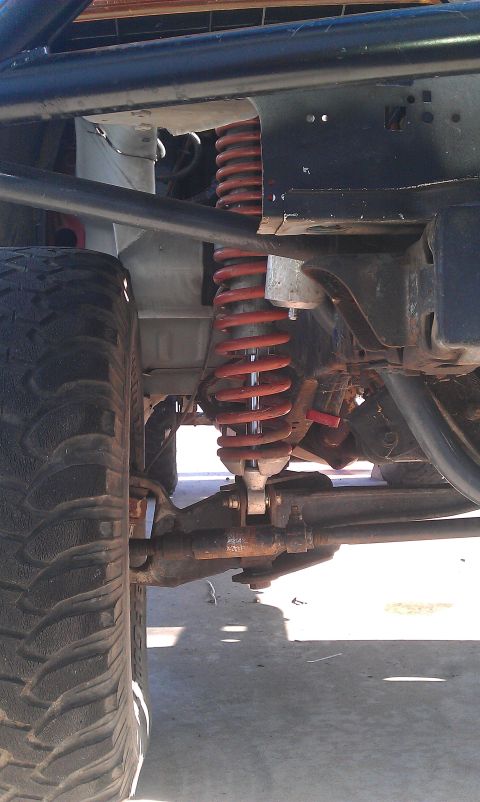 1992 Ford Ranger - Front suspension components and tire of an off-road vehicle are visible in this close-up shot.