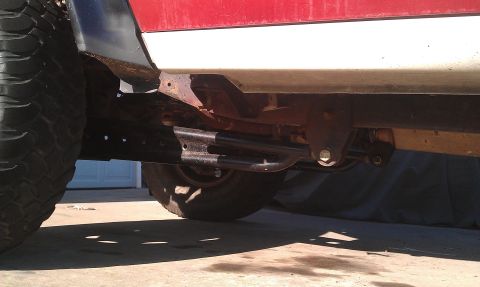 1992 Ford Ranger - Undercarriage view of a truck, showing the frame, suspension, and a large tire.
