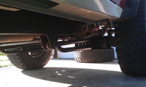 1992 Ford Ranger - Undercarriage view of a truck, focusing on suspension and large tires.