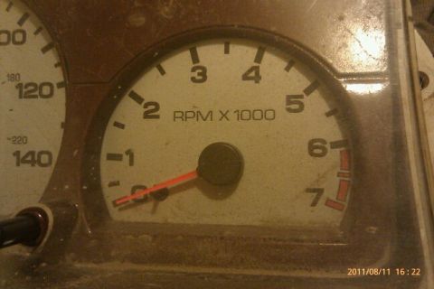 2000 Mercury Grand Marquis - The dashboard gauges show engine RPM and vehicle speed, with the tachometer indicating revolutions per minute.