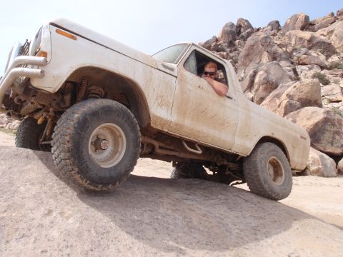 1978 Ford Bronco - A white 1978 Ford Bronco navigates a challenging rocky terrain in Johnson Valley.