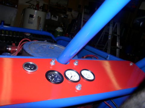 1979 Ford Bronco - Custom dashboard with gauges and a blue roll cage is visible in this interior shot.