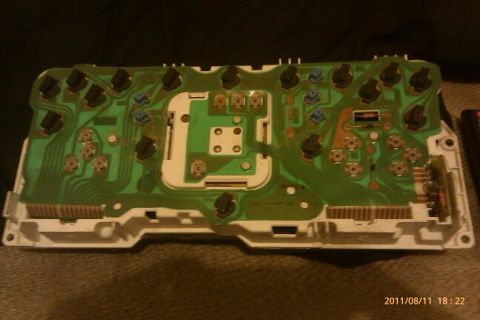 2000 Mercury Grand Marquis - The rear of a vehicle's instrument cluster circuit board is shown, revealing its internal electronic components.
