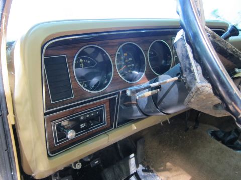 1991 Ford LTD Crown Victoria - Interior view of a vehicle's dashboard gauges and an old-school radio.