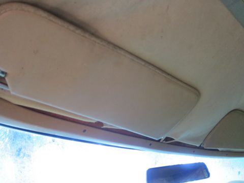 1991 Ford LTD Crown Victoria - Interior shot of the headliner and sun visors, showing the beige fabric.