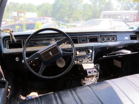1991 Ford LTD Crown Victoria - Interior view of a car with a dashboard, steering wheel, and seats, showing aftermarket radio equipment.