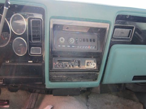 1991 Ford LTD Crown Victoria - Close-up of a car's dashboard, showing the radio and instrument cluster.