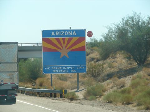 1992 Ford Taurus - Entering Arizona, the Grand Canyon State, with a semi-truck in view.