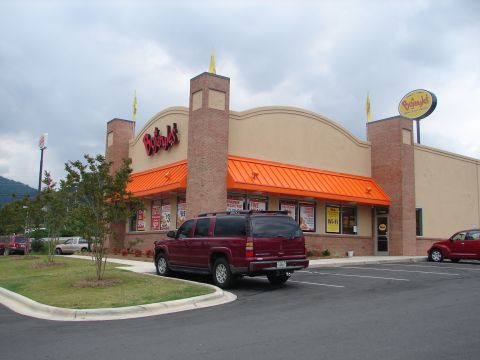 1992 Ford Taurus - A maroon SUV is parked in front of a Bojangles restaurant, with a red PT Cruiser visible on the right.