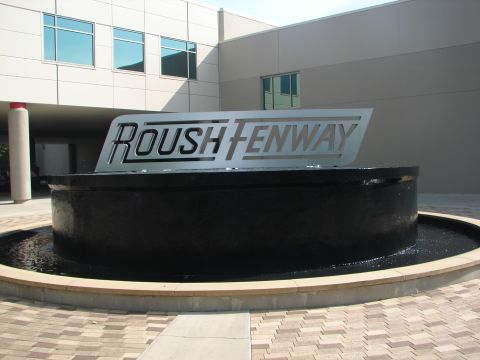 1992 Ford Taurus - Roush Fenway Racing sign is visible above a fountain outside their building.