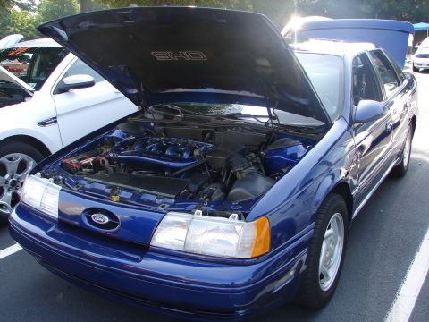 1992 Ford Taurus - Blue 1992 Ford Taurus SHO at a car meet, engine exposed for viewing.