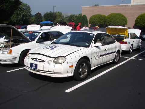 1992 Ford Taurus - A Ford Taurus is customized with New York Yankees pinstripe graphics and logos.