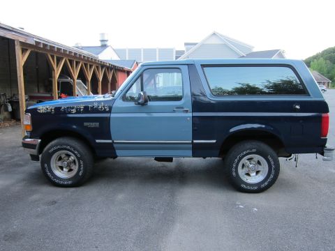 2001 Ford Crown Victoria - This Ford Bronco is a two-tone blue SUV with a side view.