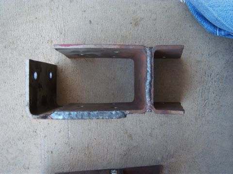 1996 Ford Bronco - A custom-fabricated metal bracket is shown, likely for automotive use, with visible welds and mounting points.