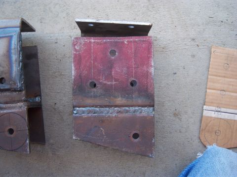 1996 Ford Bronco - These appear to be custom-fabricated metal brackets, possibly for a vehicle modification project.